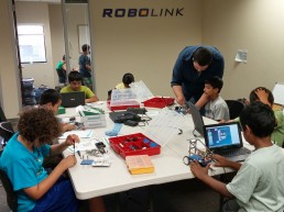 Children building with Rokit Smart in classroom